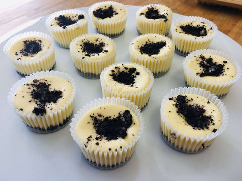 One dozen Chunky Oreo cheesecakes assorted on a circular white platter
