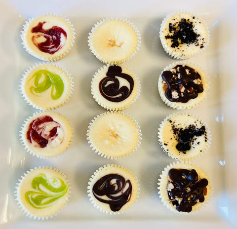 A dozen signature minis assorted on a white plate, top down view