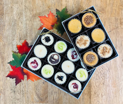 An 18 piece assortment of bite sized cheesecakes in a gift box