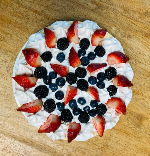 Top down view of berry medley whole cheesecake