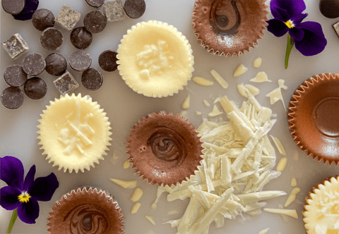 Close-up of velvety Chocolate Cheesecake Minis atop Oreo and Vanilla cookie crusts