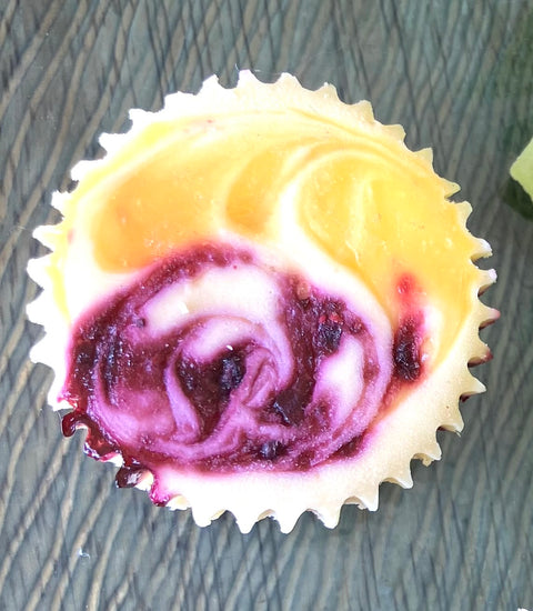 Top down, up close image of a Blueberry Lemonade cheesecake mini.