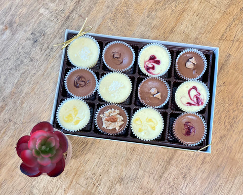 One dozen assorted mini chocolate cheesecakes in a gift box