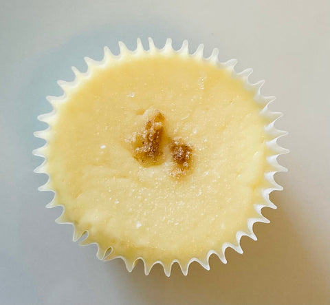 One singular classic original cheesecake mini against a white background