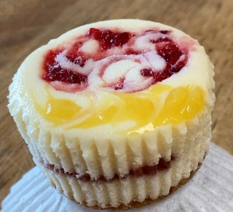 Up close, side view of our Strawberry Lemonade cheesecake mini, unwrapped.