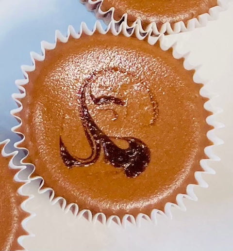 A plate of assorted mini cheesecakes with different flavors and toppings.