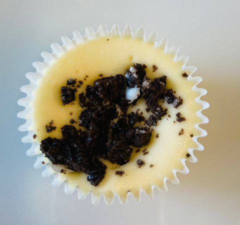 A singular Oreo cheesecake mini against a white background