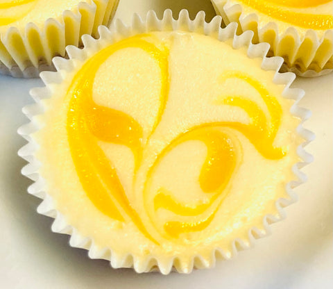 Up close image of a Luscious Lemon cheesecake mini, top down.