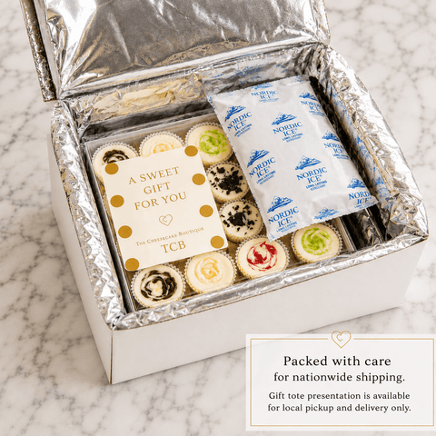 Gift box with mini cheesecakes in a insulated shipping box  treats and a card on a marble surface