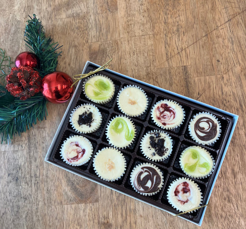 Signature Cheesecake Collection gift box with assorted gourmet cheesecake flavors, handcrafted and elegantly packaged for holiday gifting or special celebrations.